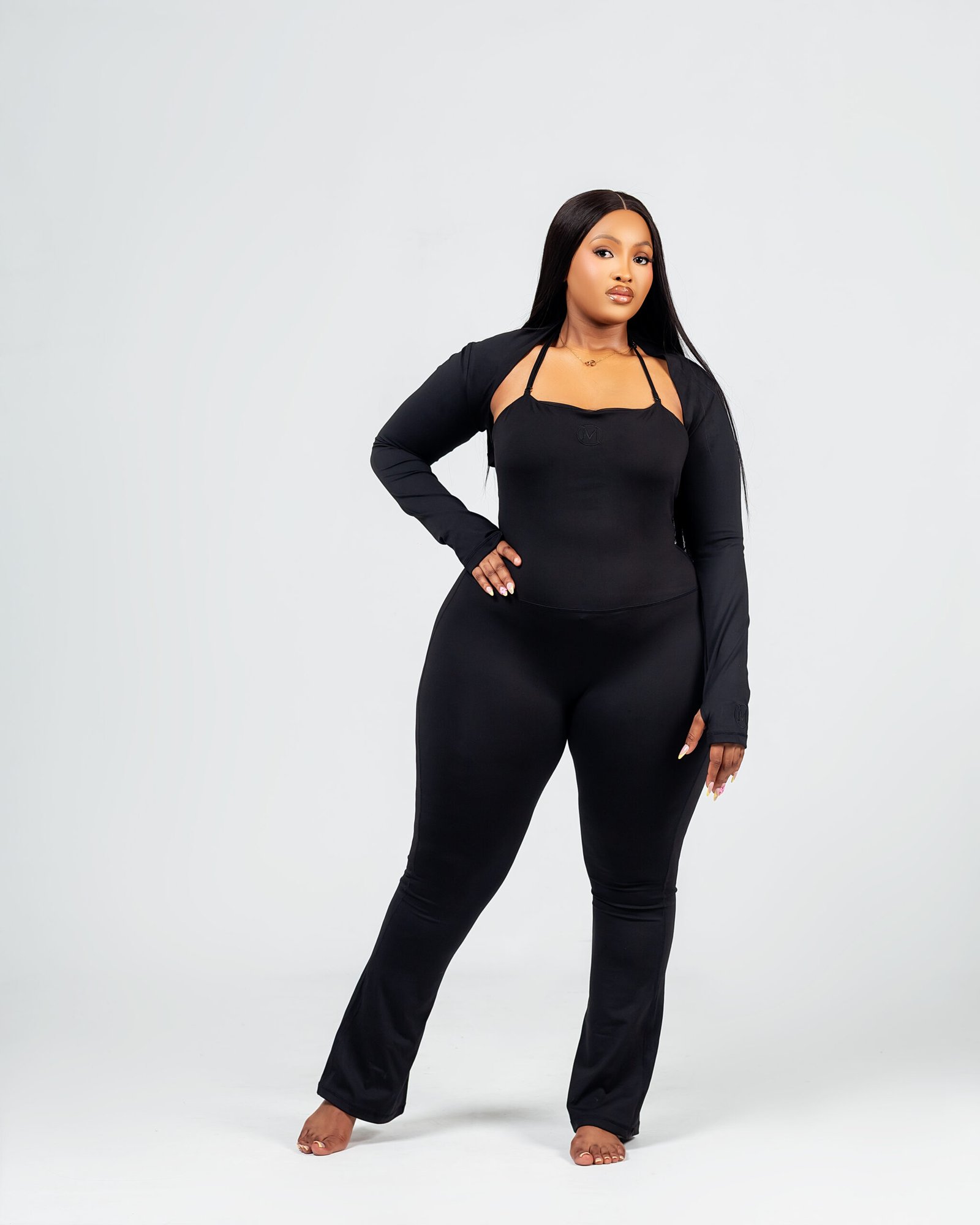 MINOKU Noku Flare — Halter-neck jumpsuit with flared leg and matching shrug.